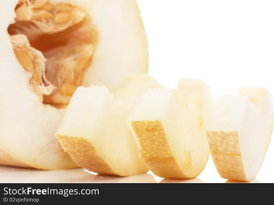 Pieces of juicy melon isolated over white