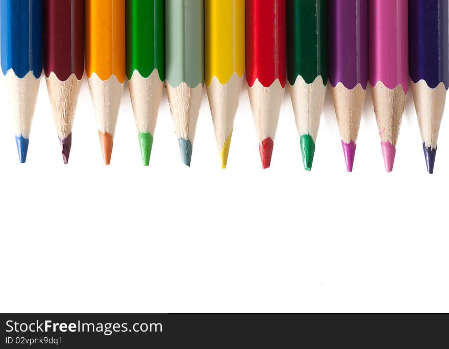 Colored pencils isolated over white background