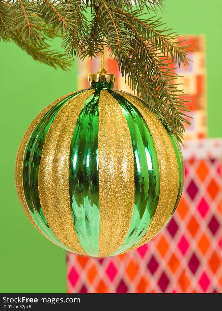 Christmas presents in background of an large tree decoration