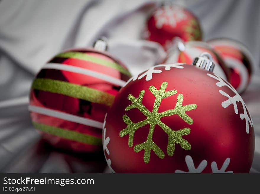 Mulitcolored ornaments on a silver background. Mulitcolored ornaments on a silver background