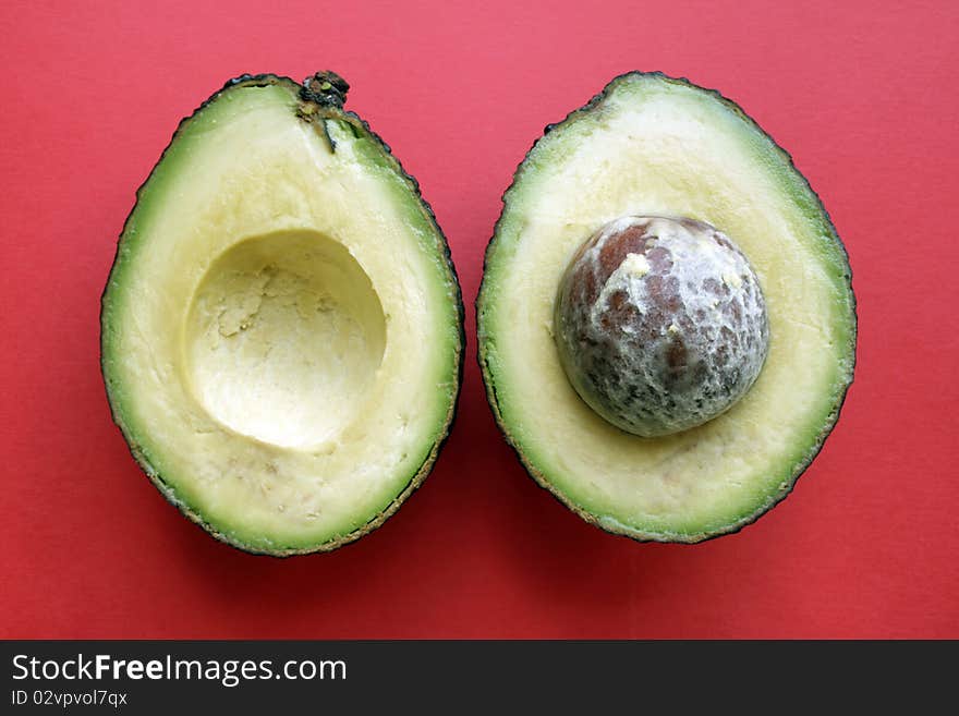 Two halfs fresh ripe avocado in isolated