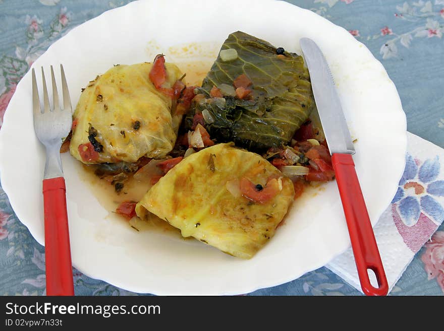 Stewed cabbage stuffed minead meat and rice with vegetables. Stewed cabbage stuffed minead meat and rice with vegetables