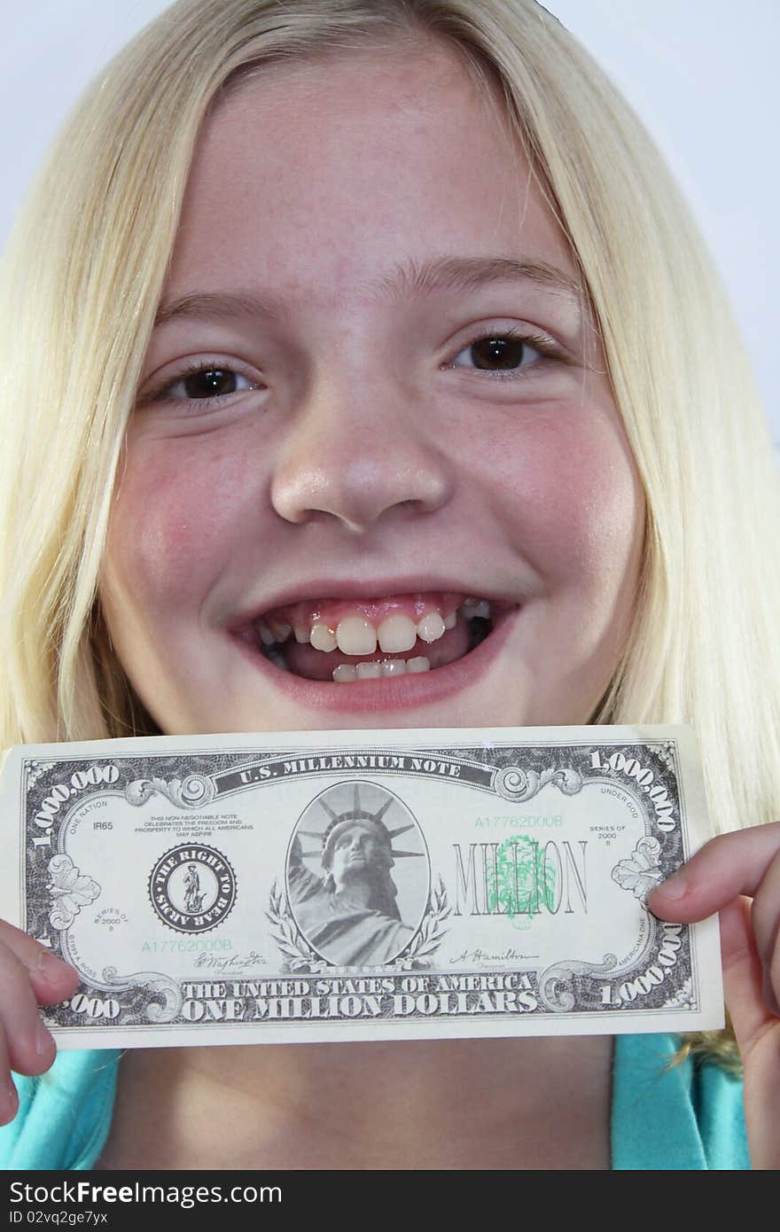 Happy girl holding a one million dollar bill. Happy girl holding a one million dollar bill.