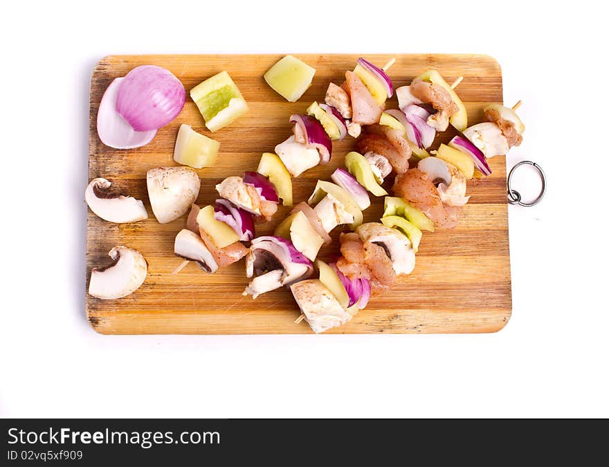 Raw chicken and vegetables skewers. Raw chicken and vegetables skewers