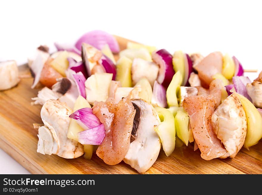 Raw chicken and vegetables skewers. Raw chicken and vegetables skewers