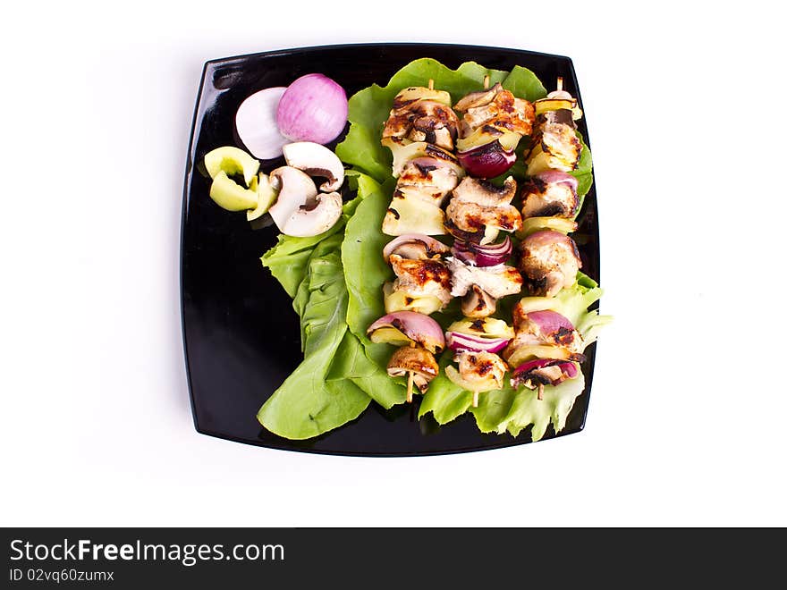 Cooked chicken and vegetables skewers. Cooked chicken and vegetables skewers