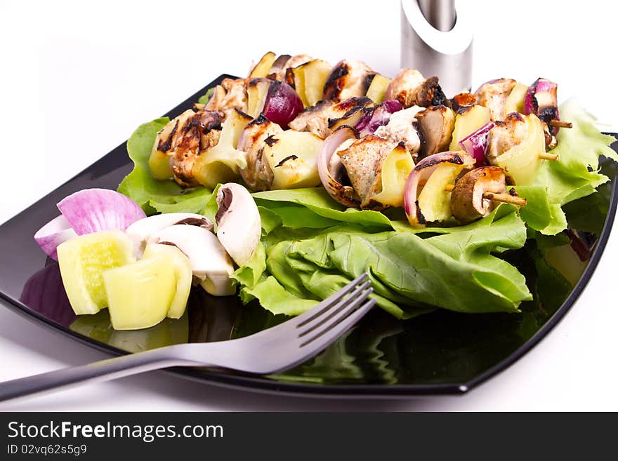 Cooked chicken and vegetables skewers. Cooked chicken and vegetables skewers