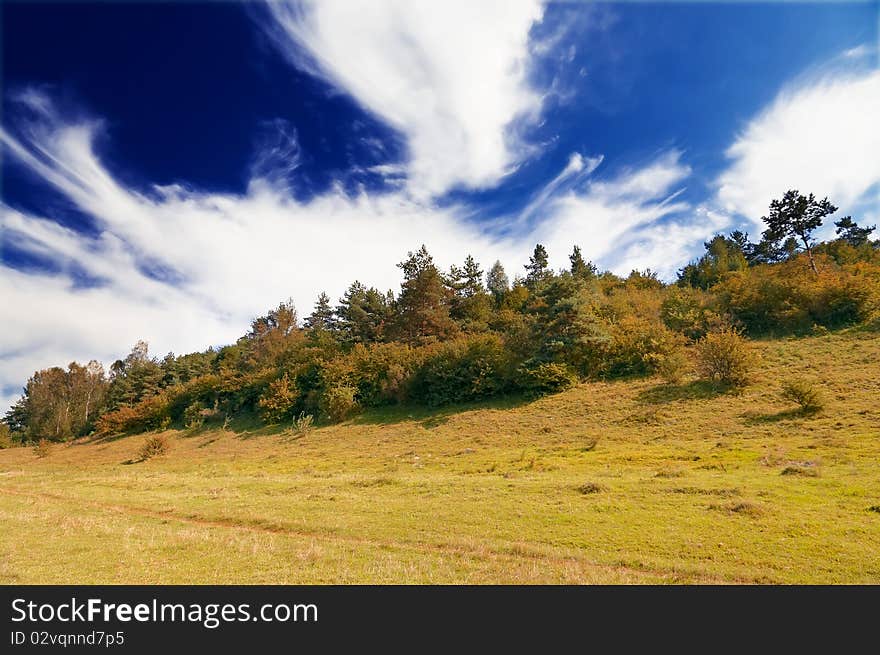 Autumnal hill and wonderful blue sky with clouds. Autumnal hill and wonderful blue sky with clouds.