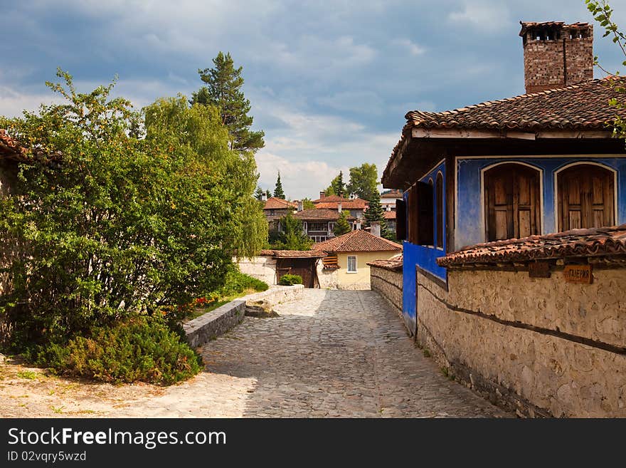 Street and houses in the old town of Koprivshtitsa, Bulgaria. Street and houses in the old town of Koprivshtitsa, Bulgaria.