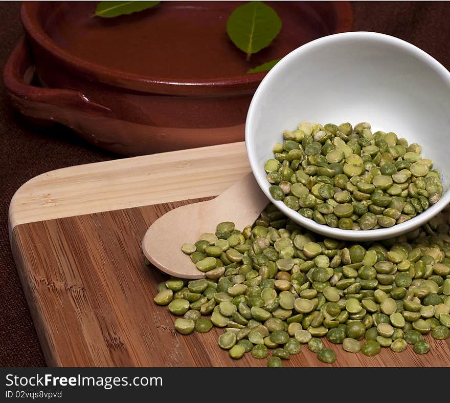 Composition with dried peas on cutting bamboo