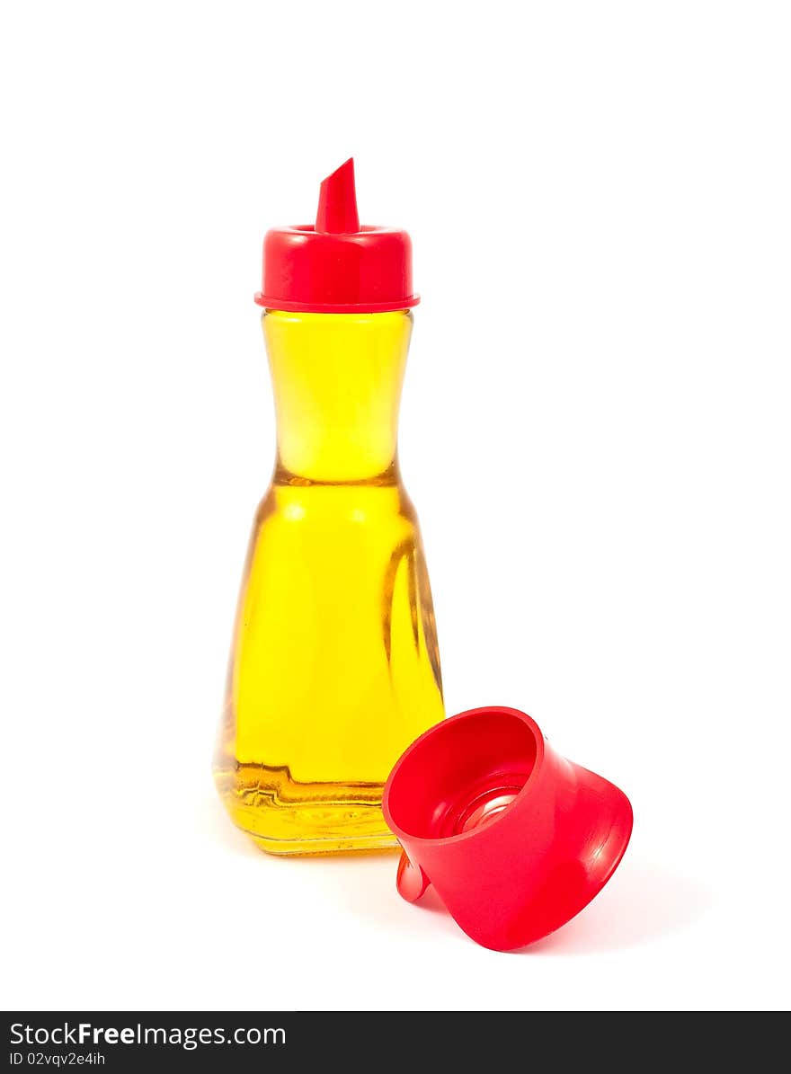 Oil in a bottle on a white background