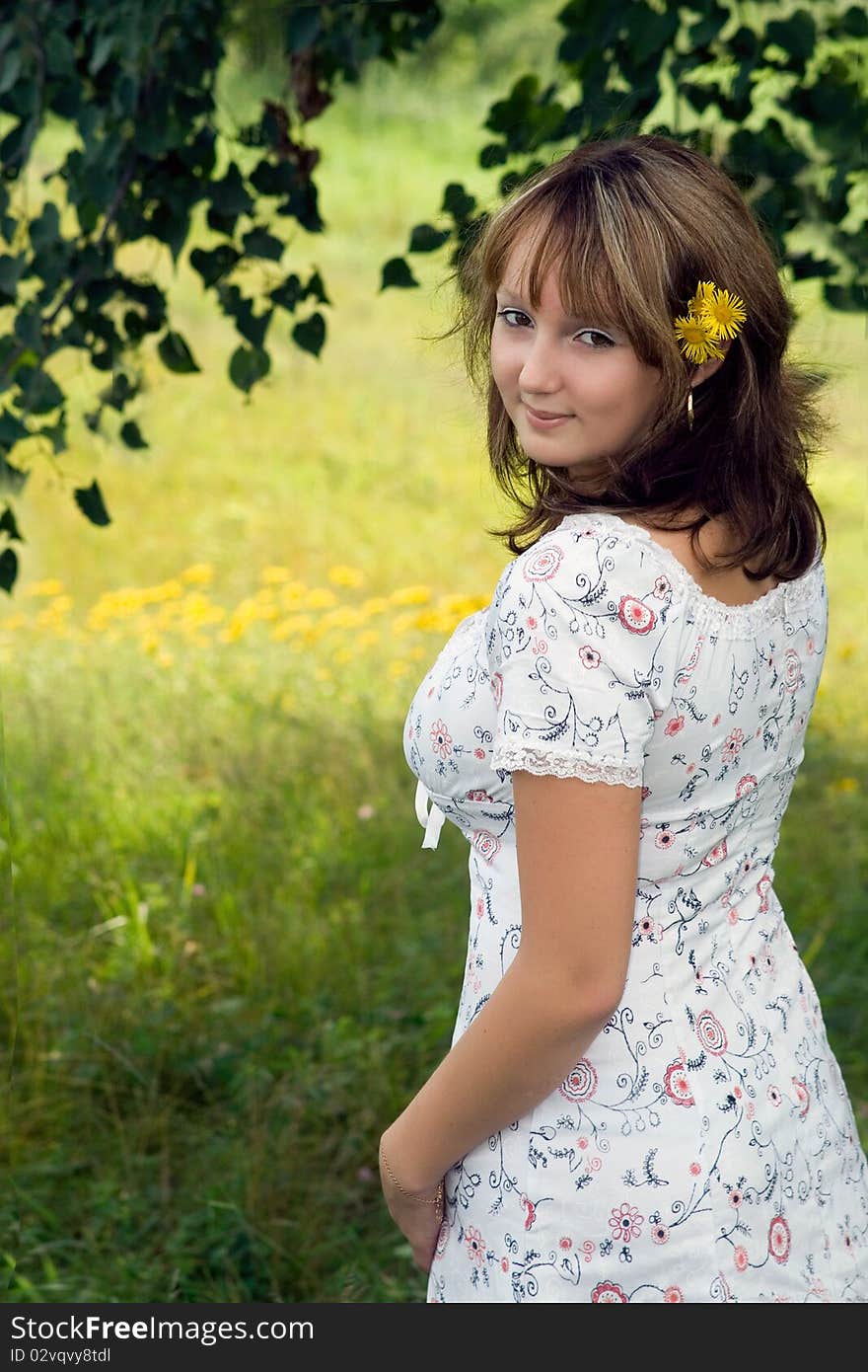 Girl, smile, yellow flowers, leafs and grass. Girl, smile, yellow flowers, leafs and grass