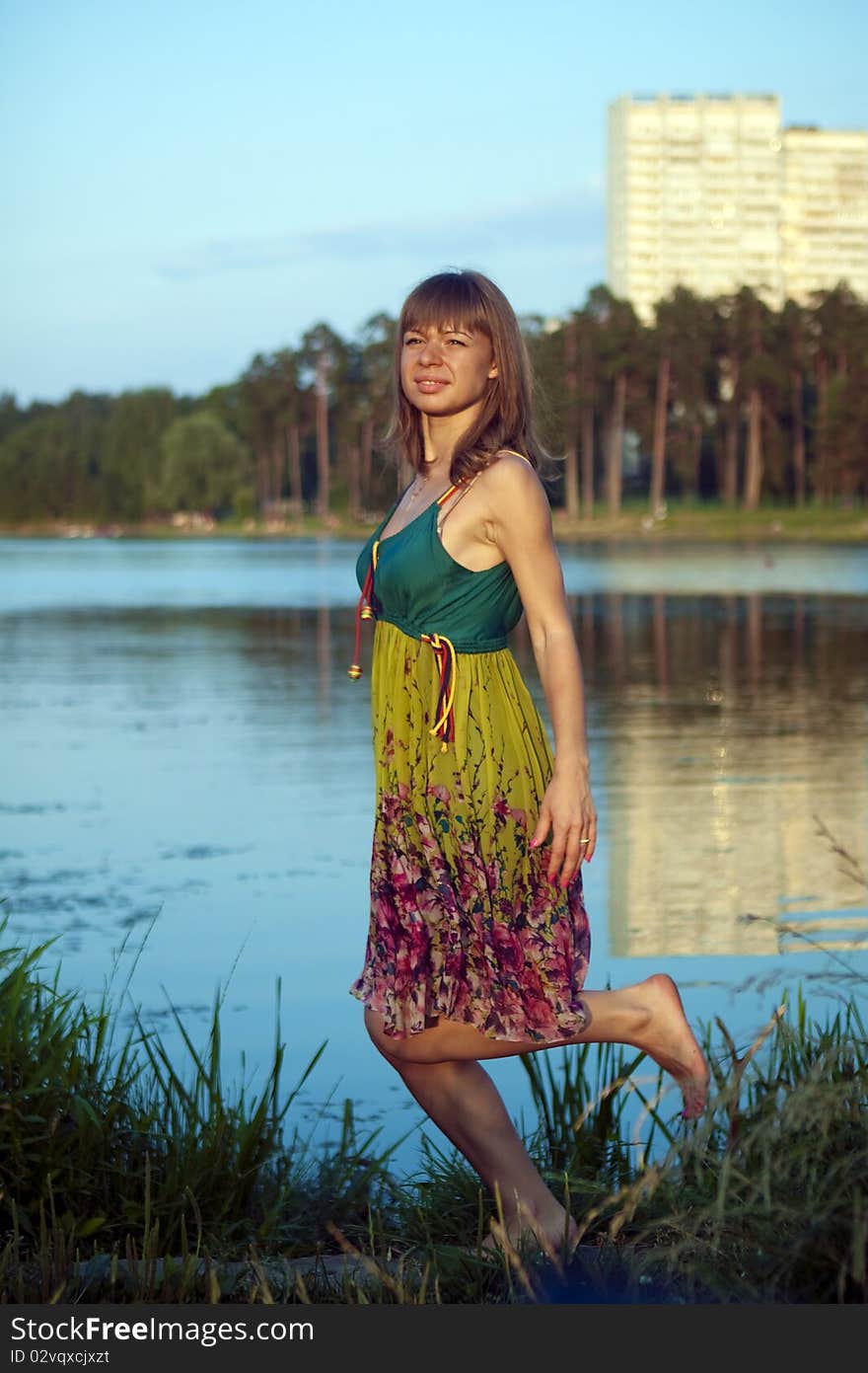 Beautiful girl in the background of the river