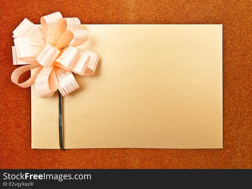 Paper blank with bow on grey background