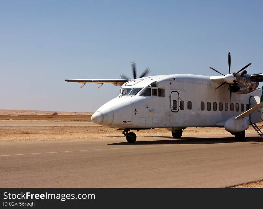 Small airplane on the runway ready to take off