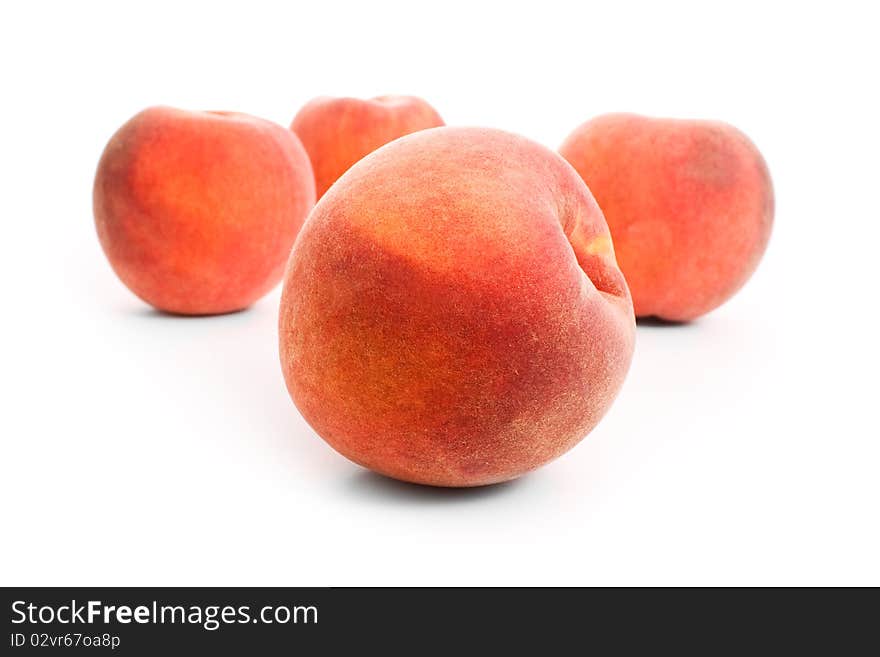 Close up shot of peaches isolated on white