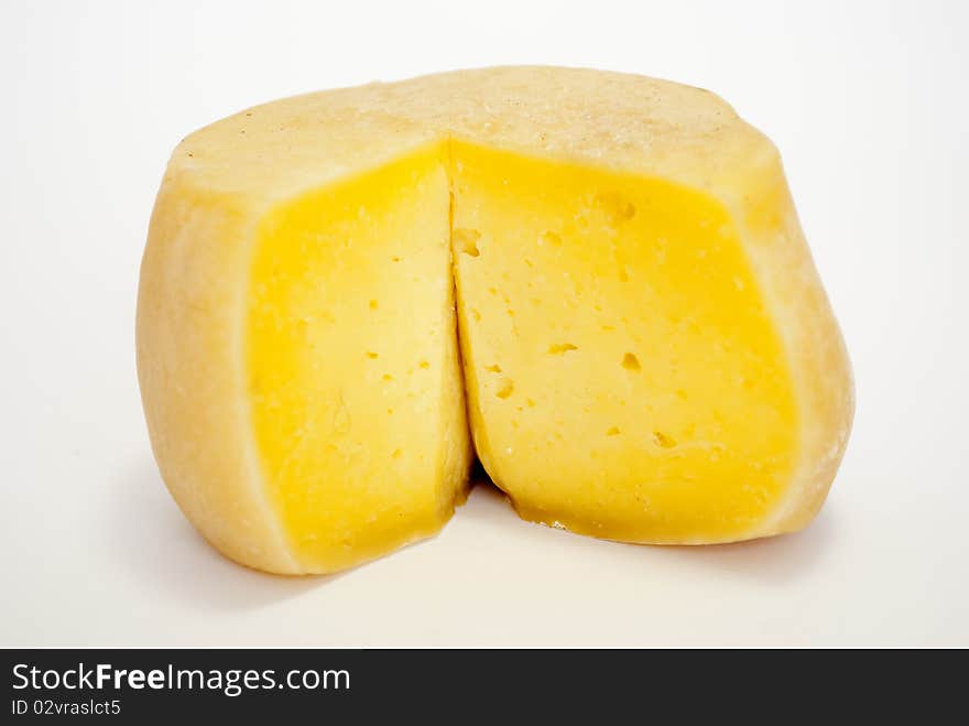 Oaf of cheddar cheese isolated on white background