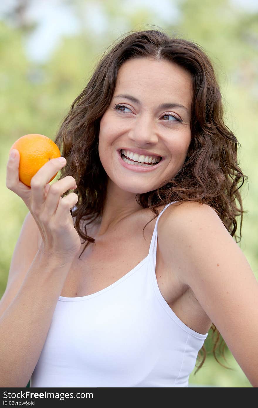 Closeup of woman eating an orange. Closeup of woman eating an orange