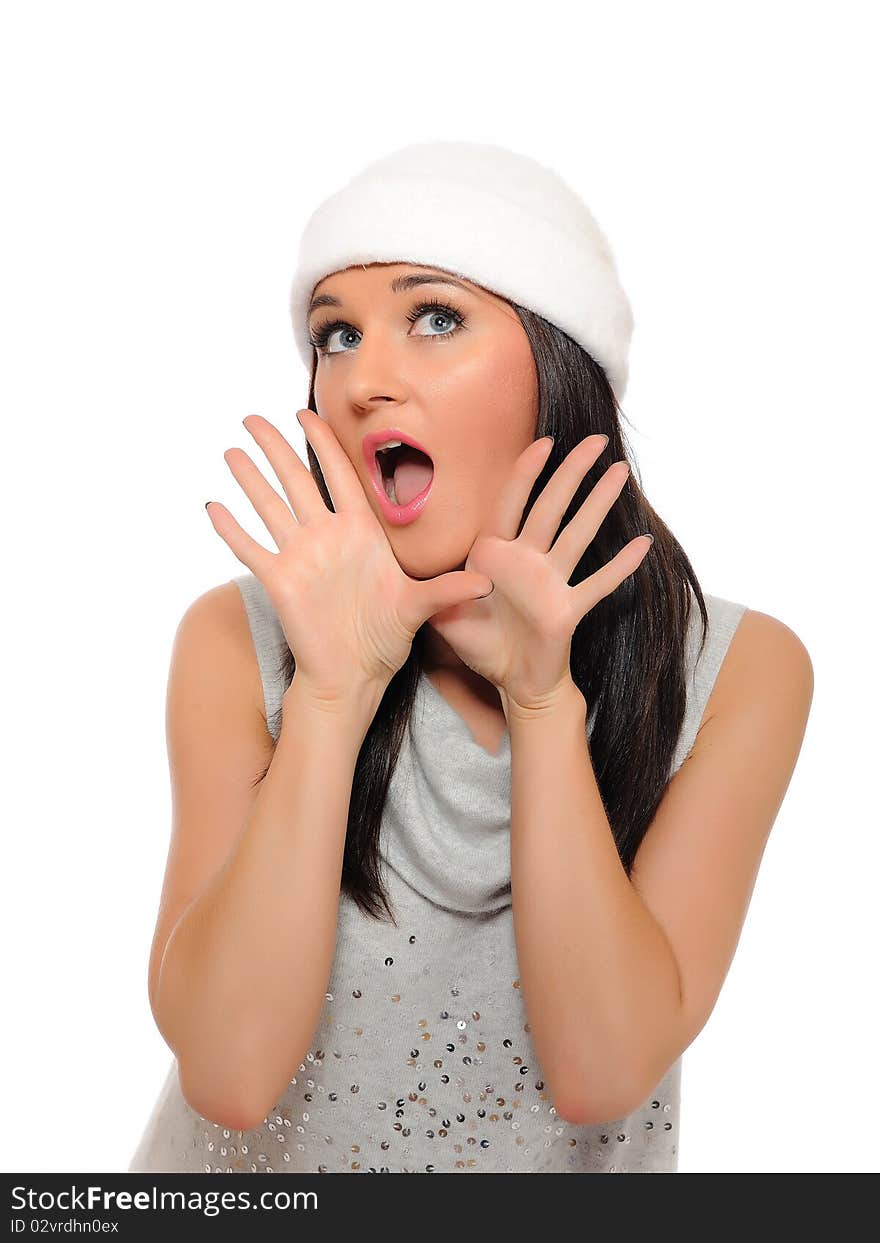 Expressions. Beautiful winter woman in a hat screaming. isolated on white background