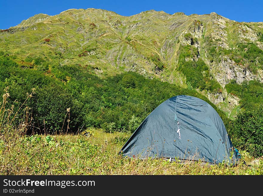 Tent against the backdrop of the magnificent mountain range