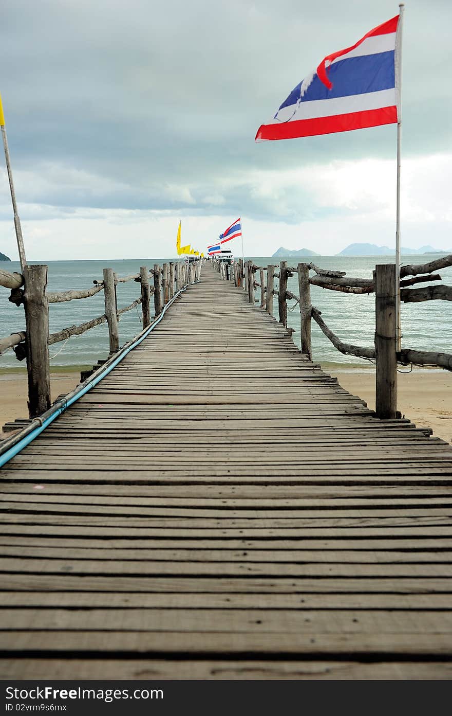 Wood bridge to the sea in South of Thailand