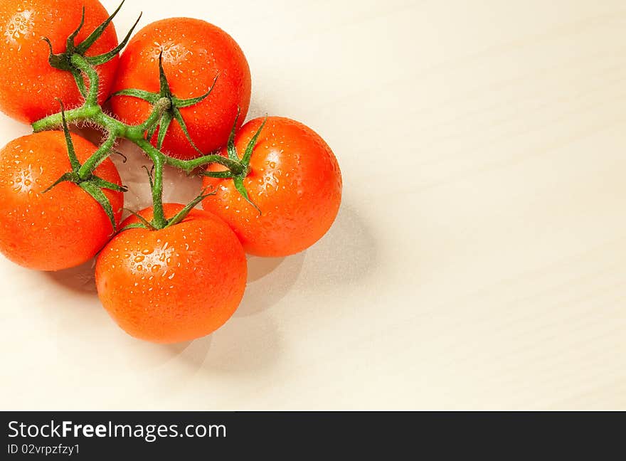 Fresh Tomatoes With Water Drops On White