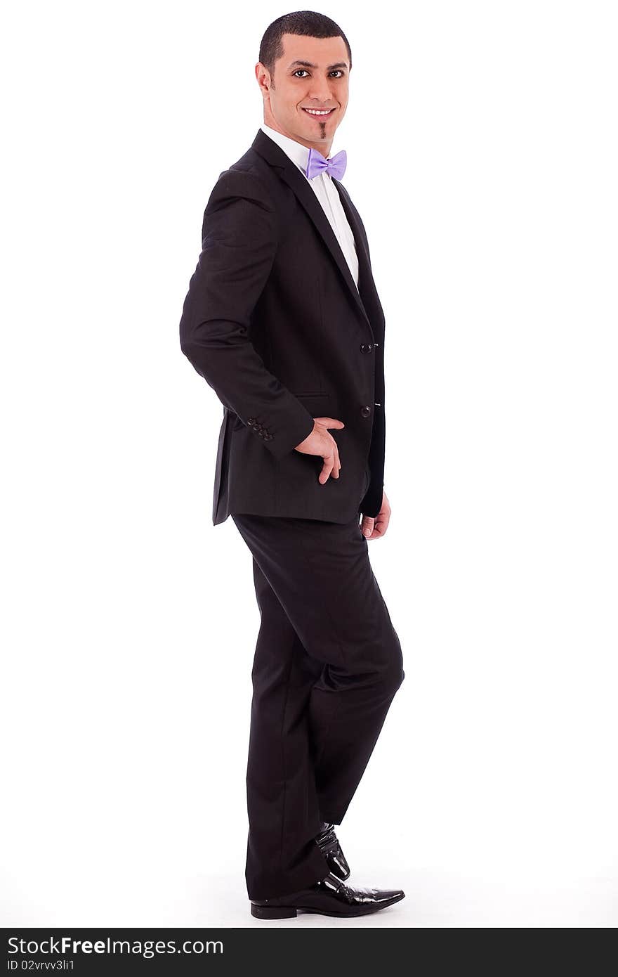 Young stylish business man standing on a white background