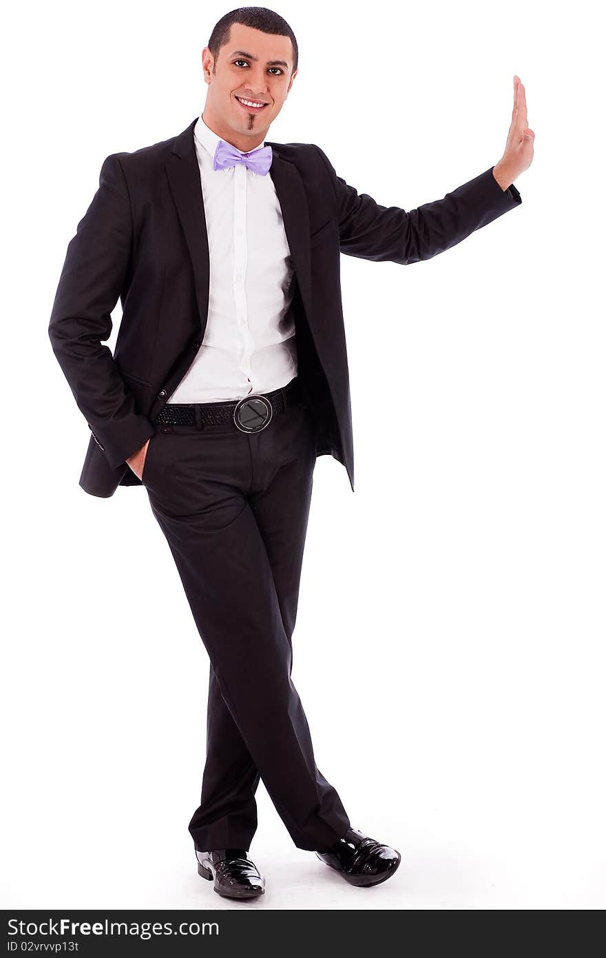 Full body portrait of a business man standing against the wall in a isolated white background. Full body portrait of a business man standing against the wall in a isolated white background