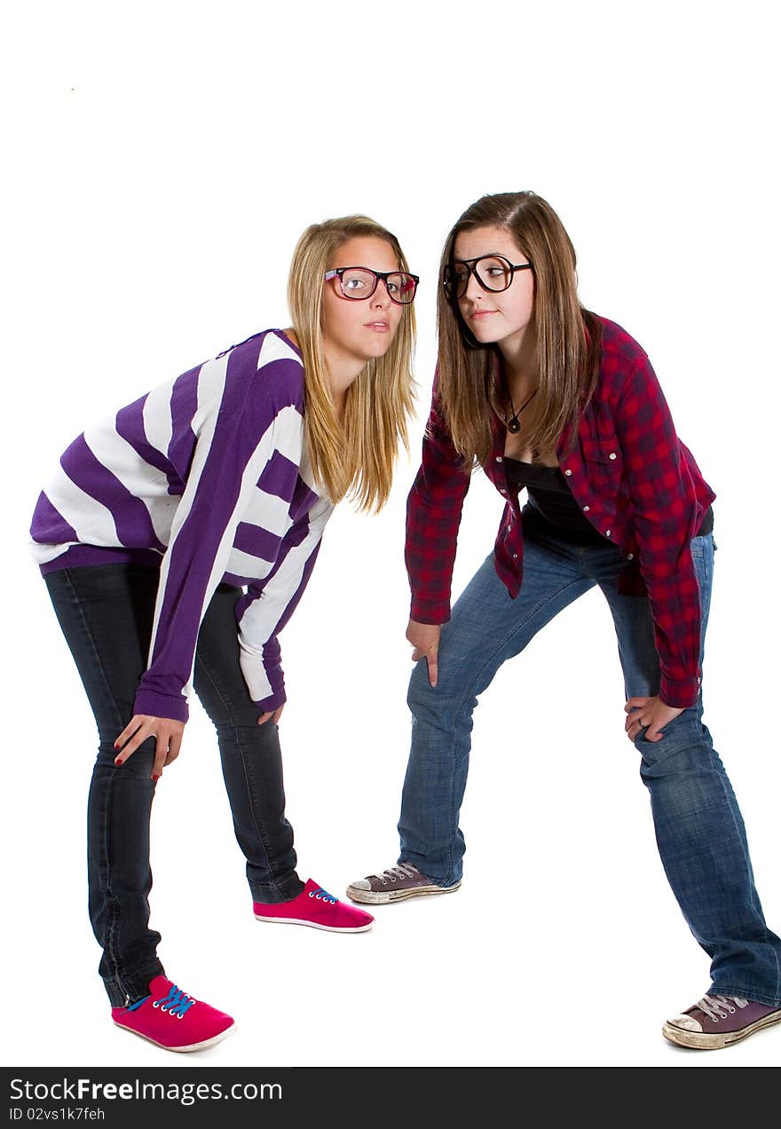 Young trendy teenagers in a nerd / geek style. Isolated over white background.