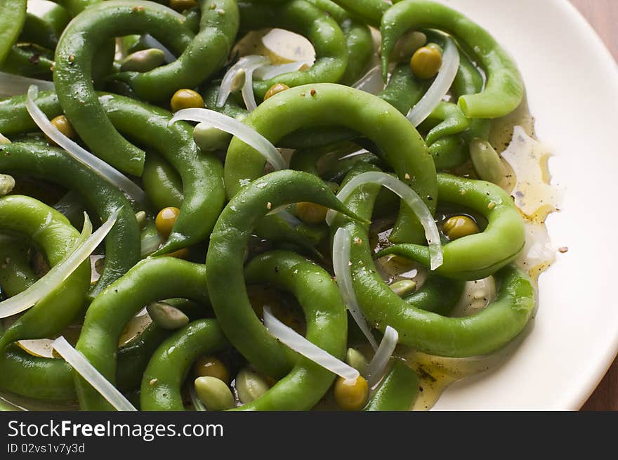 Fresh green bean salad with onion and vinegar close up