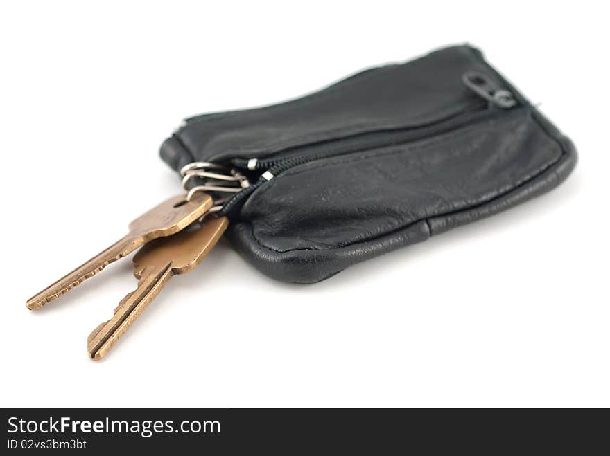 Closeup of a pair of golden house keys on a keyring.