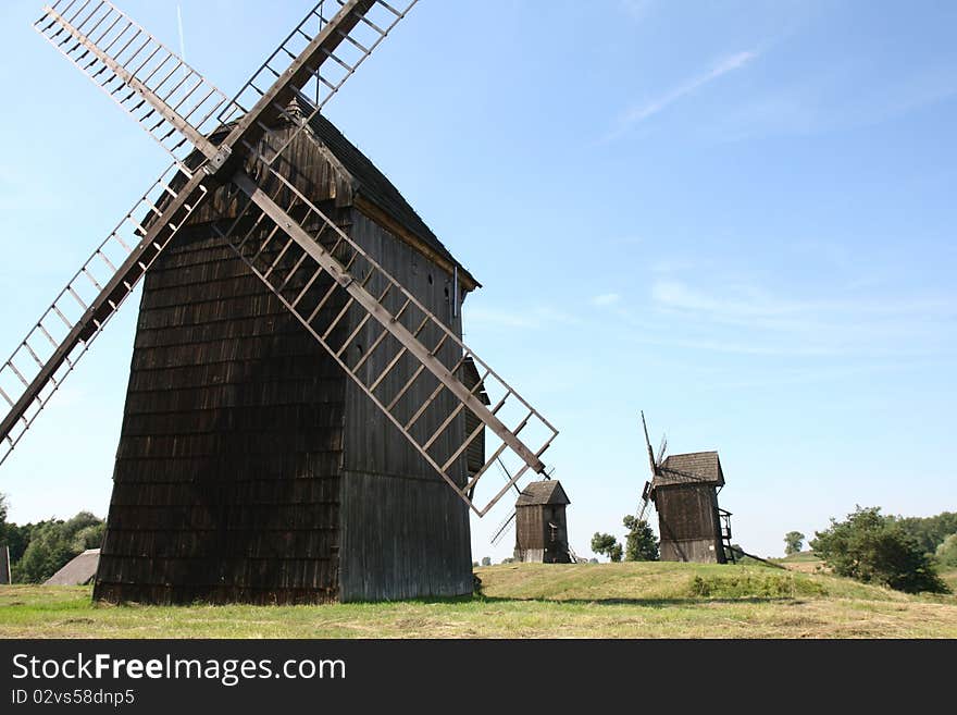 Antique trestle type Windmills from the 19th century on a hill