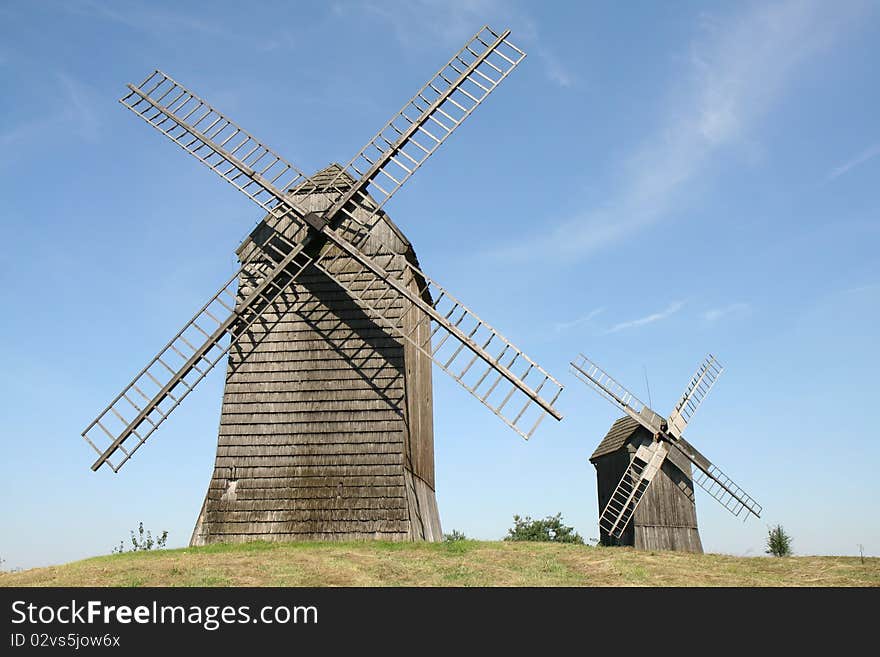 Antique trestle type Windmills from the 19th century on a hill