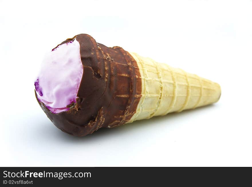 Strawberry ice-cream-small horn with chocolate close up