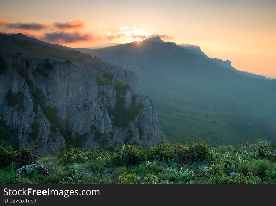 Mountain landscape with view of dramatic sunrise