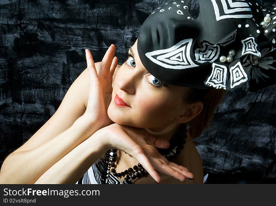 Beautiful seductive woman wearing couture and posing in a studio. Beautiful seductive woman wearing couture and posing in a studio