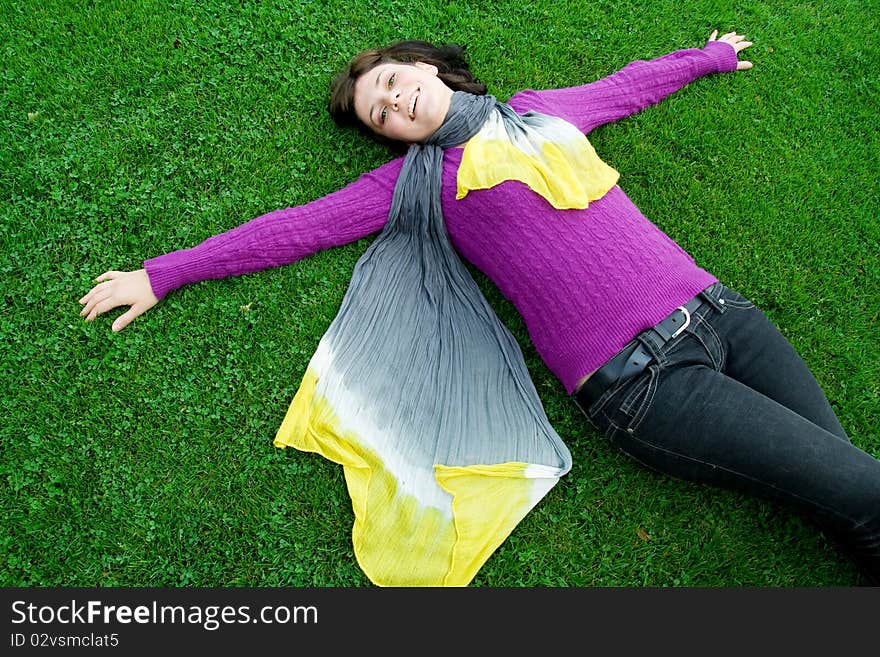 Beautiful green eyes natural girl on grass