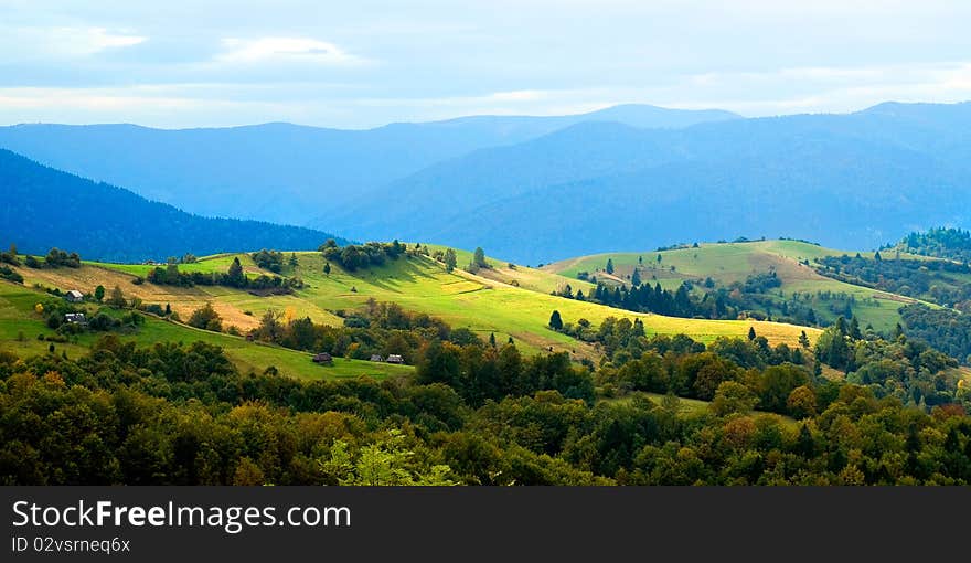 Ukrainian tranquil autumnal landscape with meadow and mountains. Ukrainian tranquil autumnal landscape with meadow and mountains.