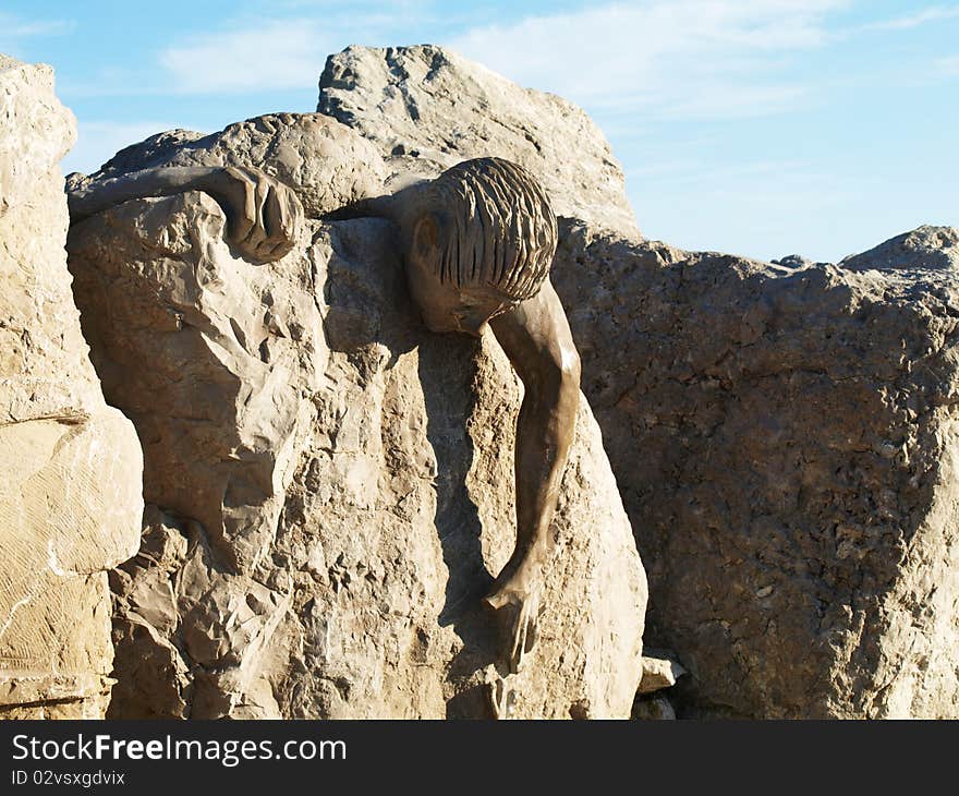 Statue carved in stone on the coast. Statue carved in stone on the coast