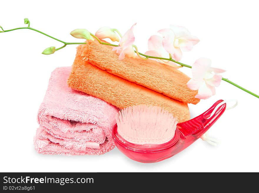 Two rolled towels and flower on white background. Two rolled towels and flower on white background