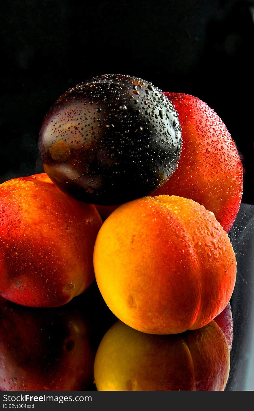 Peaches, are perfused by the water, removed on a black background. Peaches, are perfused by the water, removed on a black background