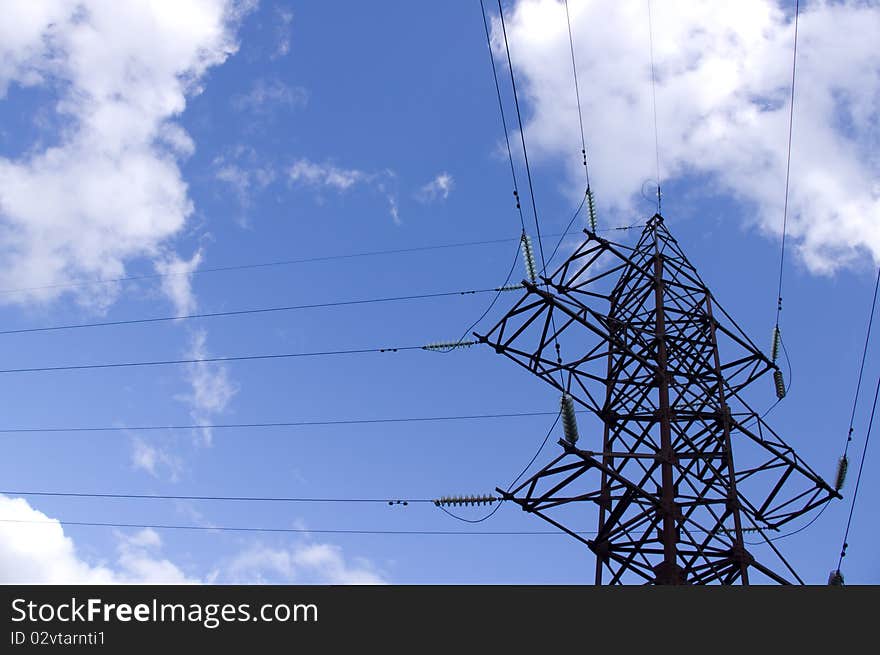 Transmission line support against the blue sky