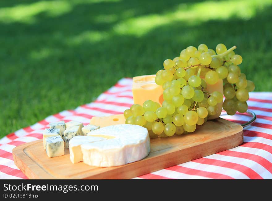 Cheese with white grapes