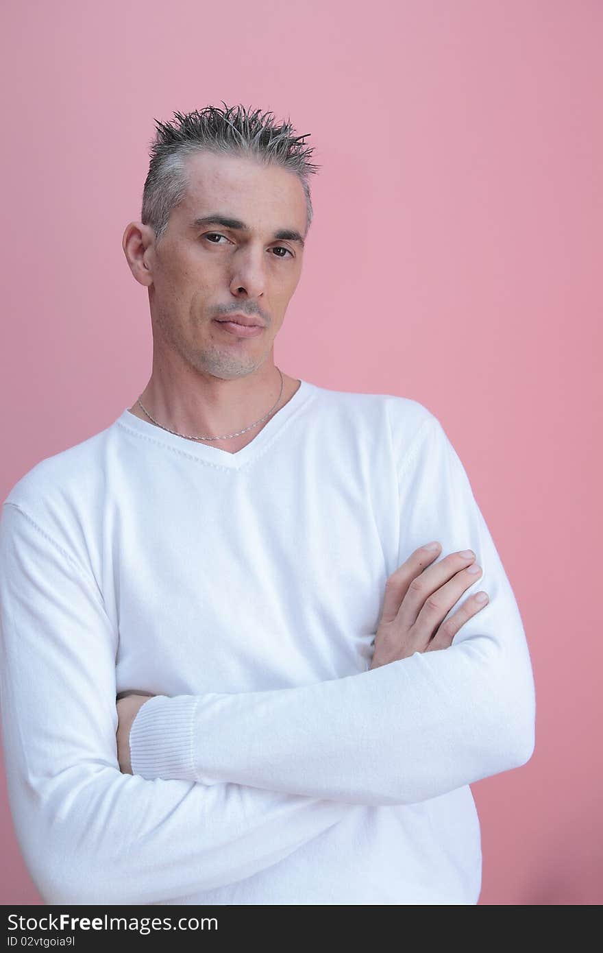 Man with white shirt and his arms folded. Man with white shirt and his arms folded