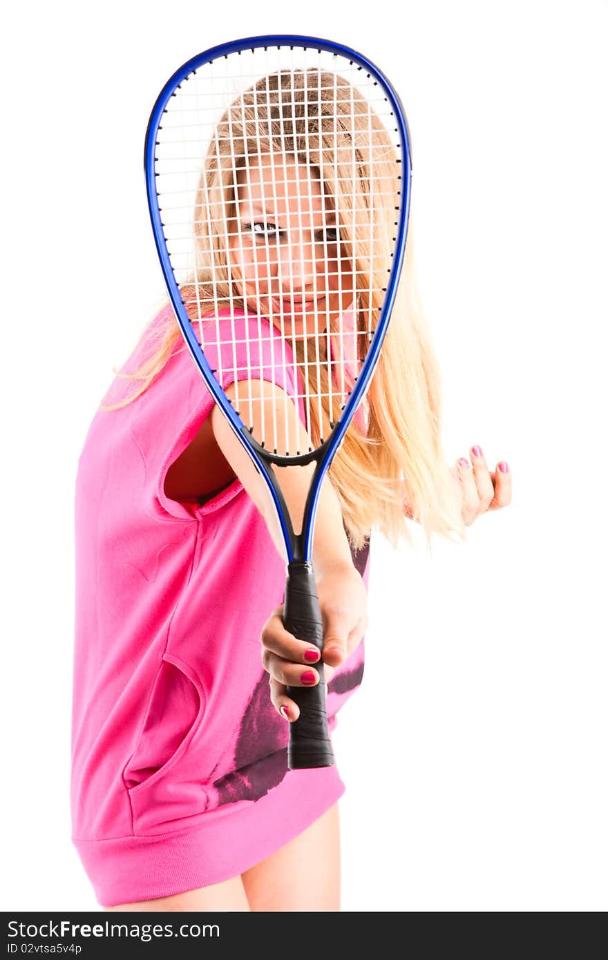 Young woman looking through a tennis racket. Young woman looking through a tennis racket