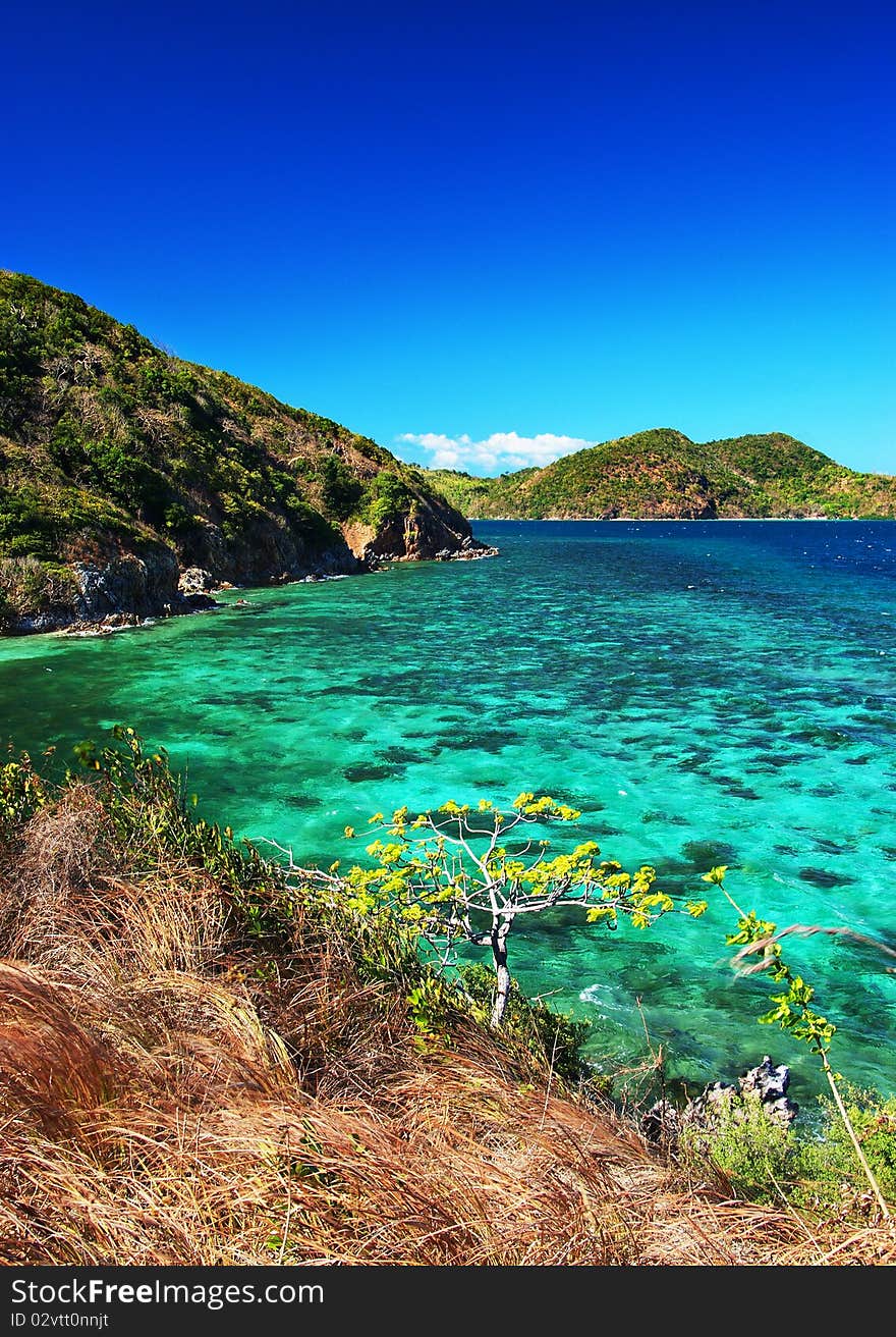 The view on the head of the island. Azure skies on emerald waters. The view on the head of the island. Azure skies on emerald waters.