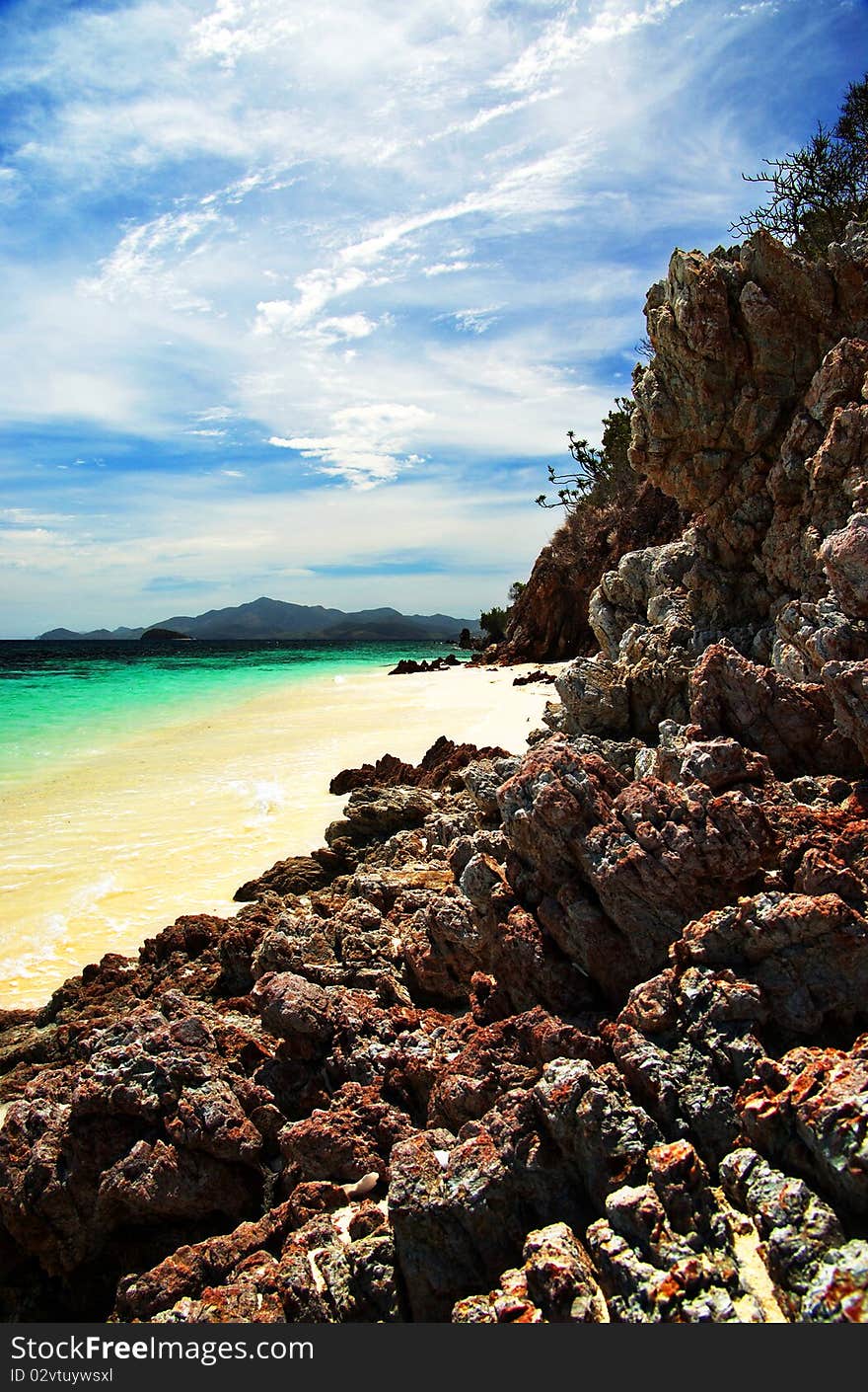 The sky, the rocks, the sand, and the water make malcapuya's shoreline such a wonder to behold. The sky, the rocks, the sand, and the water make malcapuya's shoreline such a wonder to behold.