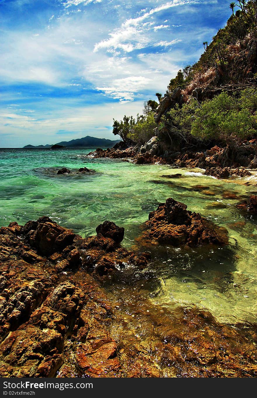 The sky, the rocks, the sand, and the water make malcapuya's shoreline such a wonder to behold. The sky, the rocks, the sand, and the water make malcapuya's shoreline such a wonder to behold.