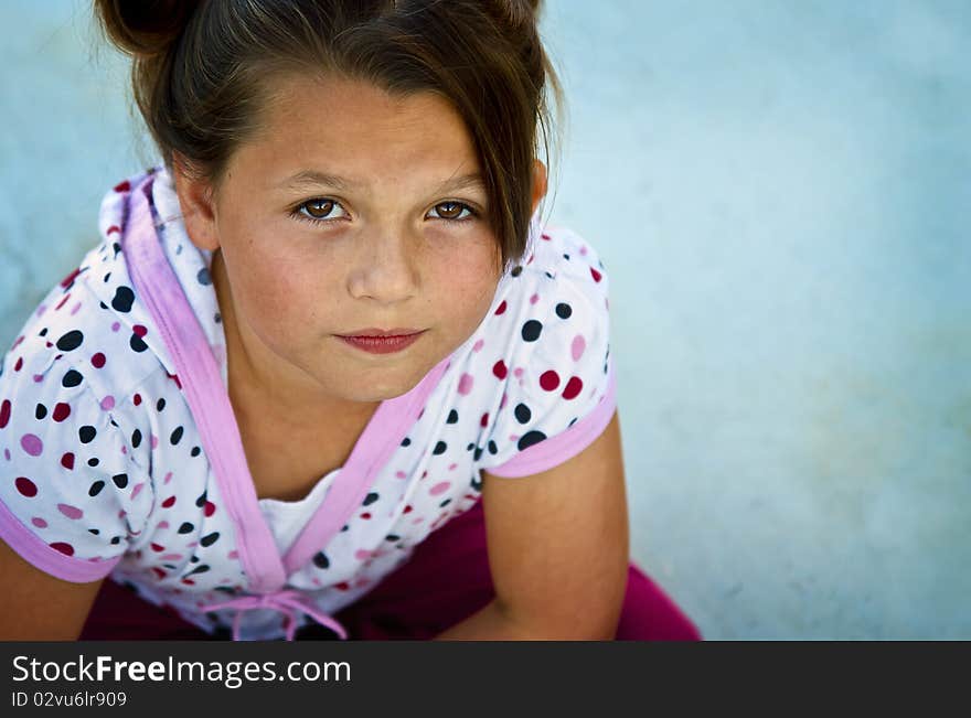 Beautiful Young Girl On A Concrete Patio.