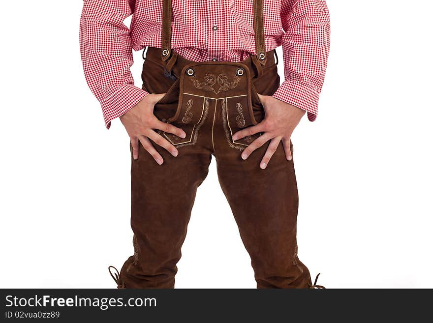 Closeup of a Bavarian man with hands in oktoberfest leather trousers (lederhose) pocket. Closeup of a Bavarian man with hands in oktoberfest leather trousers (lederhose) pocket.